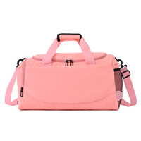 カスタム ピンク スポーツ ダッフル バッグ シューズ コンパートメントとウェット ポケット付き女性用の大きなトラベル ダッフル バッグ
